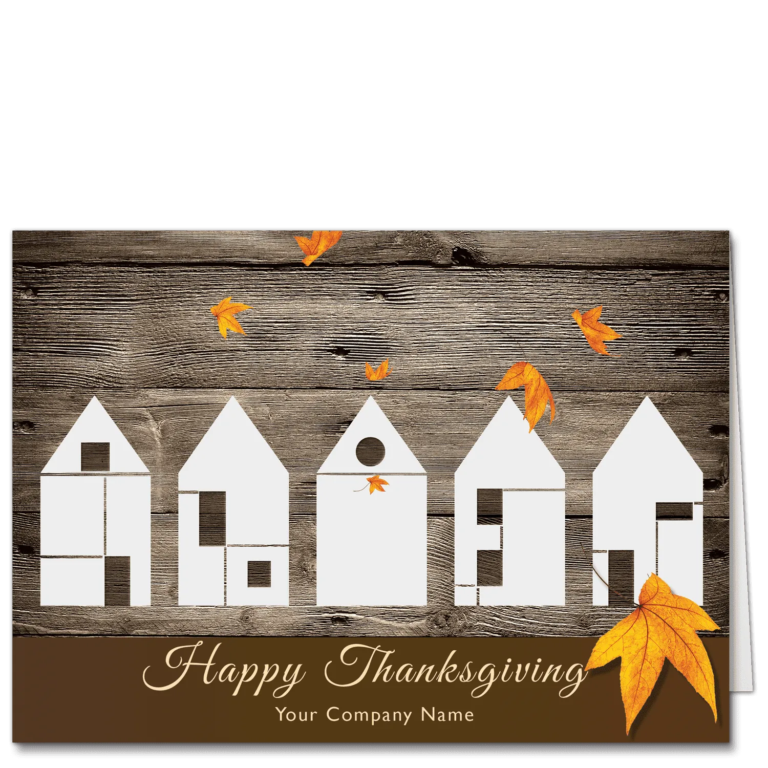 Company Thanksgiving cards with a contemporary design. Five Type 5 construction style houses all in a row against a rich, warm brown wood barn style background. A few bright orange autumn leaves are falling and your company name is featured on the card front at the bottom.