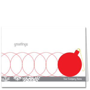 Business Christmas Cards Rolling Through the Holidays 3502 Red circles of kinetic energy and a festive red Christmas tree ornament.