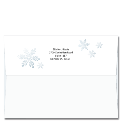 Snowflakes surround your return address on the back of these self sealing greeting card envelopes.