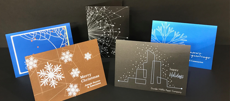 Images of architect designed christmas cards printed in white ink on shimmering card stocks.