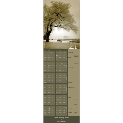 This calendar greeting card features a frosty winter scene with large tree and bench.