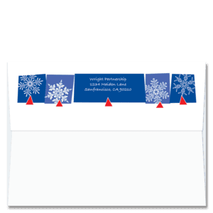 Custom design self-sealing FlapArt envelope with white snowflakes on a bright blue background and printed with your return address.
