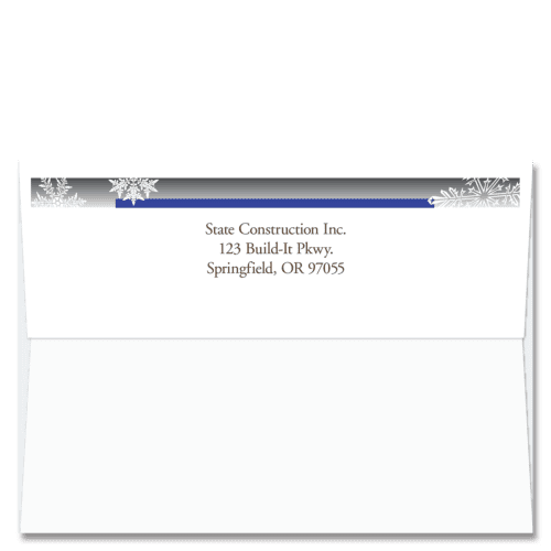 Custom design self-sealing FlapArt envelopes with navy blue band and white snowflakes to accent your printed return address.