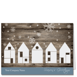 Holiday Card with five abstract white houses on a barn wood background, snowflakes and features your company name and greeting on the card front.