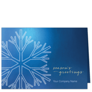 Elegant financial Christmas cards with stylized white snowflake on rich shimmery blue card stock. Features your choice of card front text greeting and company name.