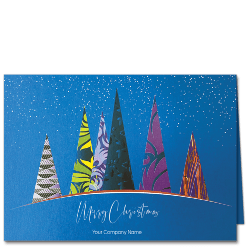 Custom Christmas cards with a modern forest scene of stylized Christmas trees in wild patterns against a shimmery blue background with white dot snowflakes. Your choice of greeting and company name can be edited online for free.