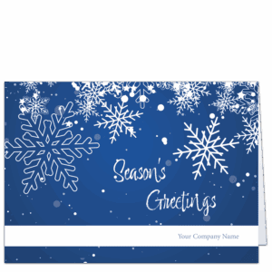 These business holiday cards feature a sprinkling of white snowflakes against a blue background. You choice of holiday greeting and your company name is featured on the front.
