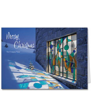 Elegant corporate holiday cards depicting light shining through and art nouveau stained glass window and on to a fresh bank of snow. Your company name and selection of greeting is on the card front.