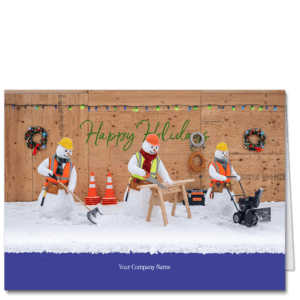 This architecture holiday card features three snowmen working on a job site with a sawhorse, a shovel and a snow blower. Your company name is featured below and your choice of greeting is on the plywood wall in the background.